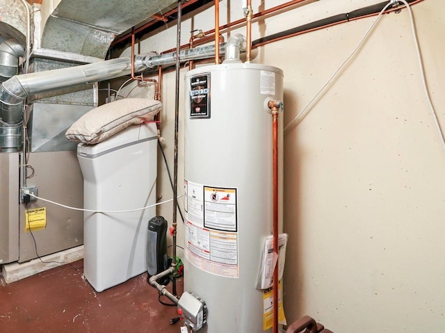 utility room featuring water heater