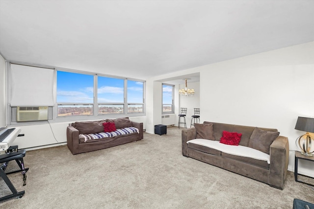 living area featuring cooling unit, a notable chandelier, and carpet flooring