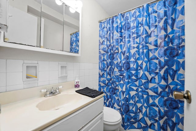 full bath with tile walls, a shower with shower curtain, toilet, and vanity