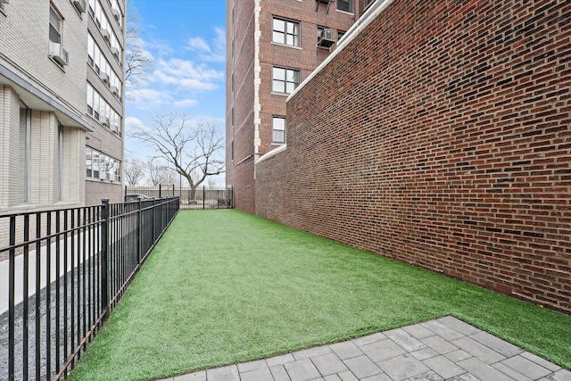 view of yard with a fenced backyard