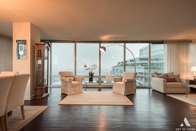 living room with expansive windows and dark wood-style flooring