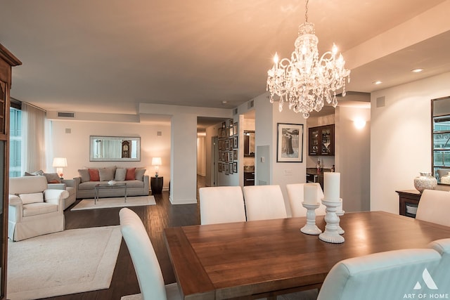 dining room featuring dark wood-type flooring, recessed lighting, and visible vents