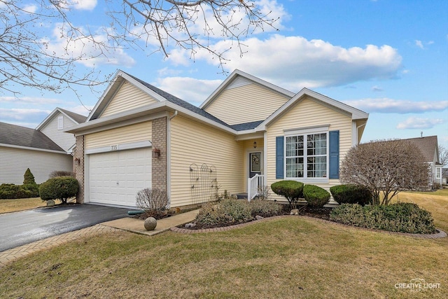 ranch-style home featuring an attached garage, driveway, brick siding, and a front yard