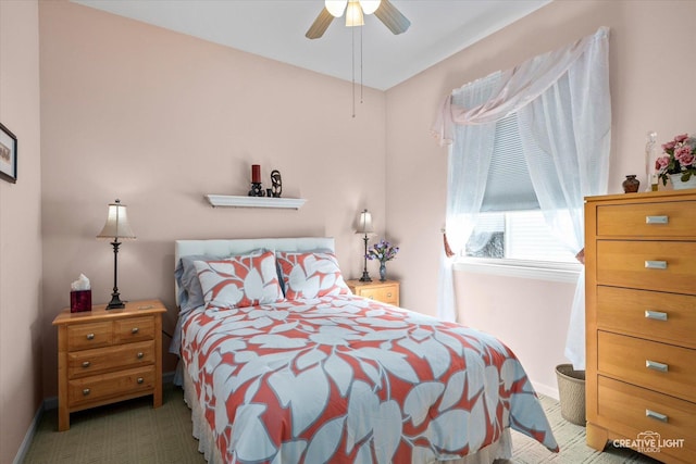 bedroom with a ceiling fan, carpet, and baseboards