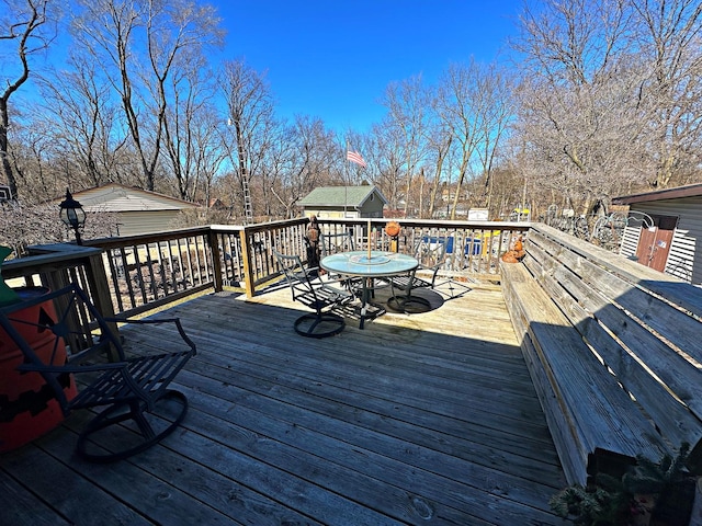 deck with outdoor dining space