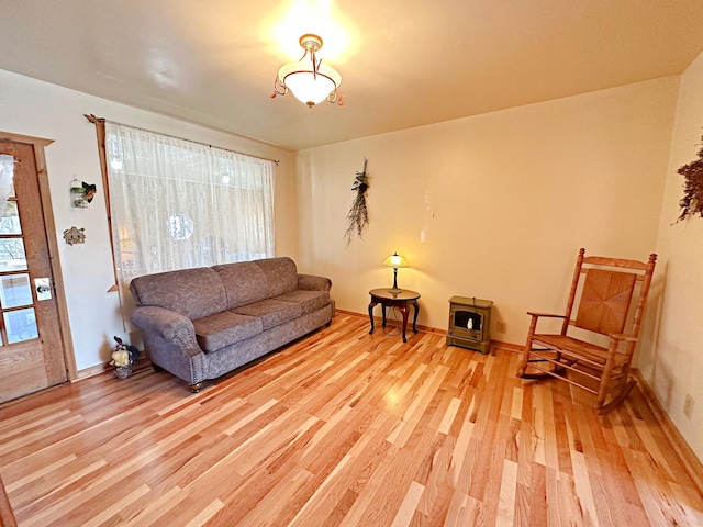 living room featuring baseboards and wood finished floors