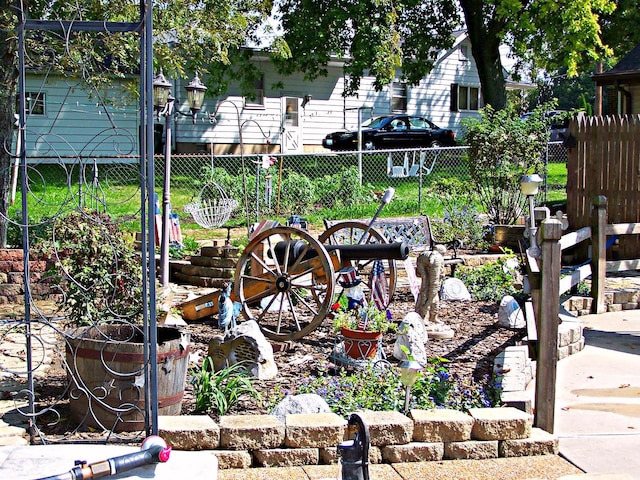 exterior space featuring fence and a vegetable garden