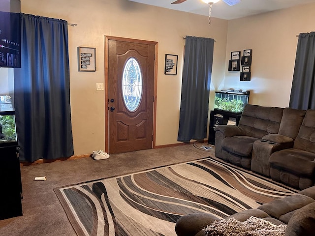 carpeted entryway with a ceiling fan