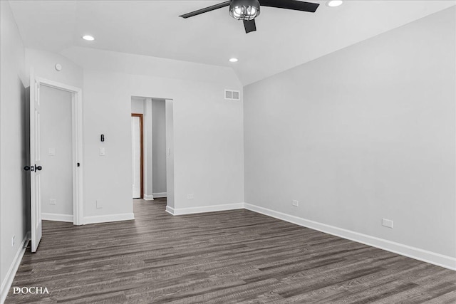 unfurnished bedroom featuring dark wood finished floors, recessed lighting, visible vents, vaulted ceiling, and baseboards