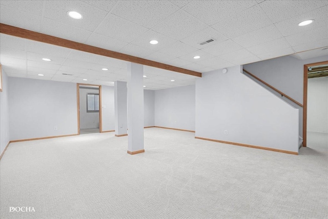 finished basement with light carpet, baseboards, and recessed lighting