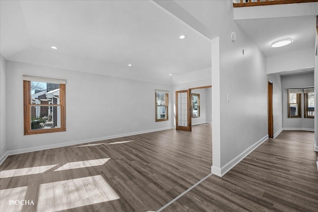 unfurnished living room featuring baseboards, wood finished floors, and recessed lighting