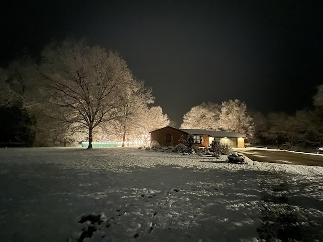 view of community with a garage and driveway