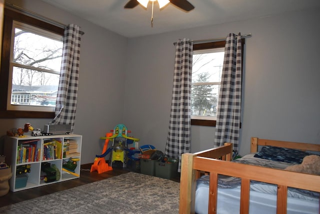 bedroom featuring a ceiling fan and wood finished floors