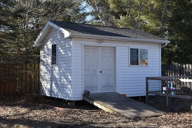 view of shed with fence