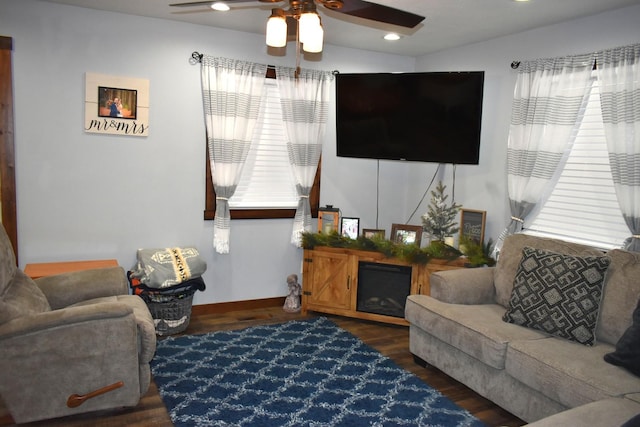 living area featuring ceiling fan, baseboards, wood finished floors, and recessed lighting