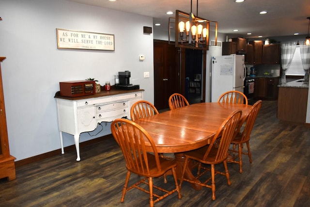 dining room featuring dark wood-style floors, baseboards, a chandelier, and recessed lighting