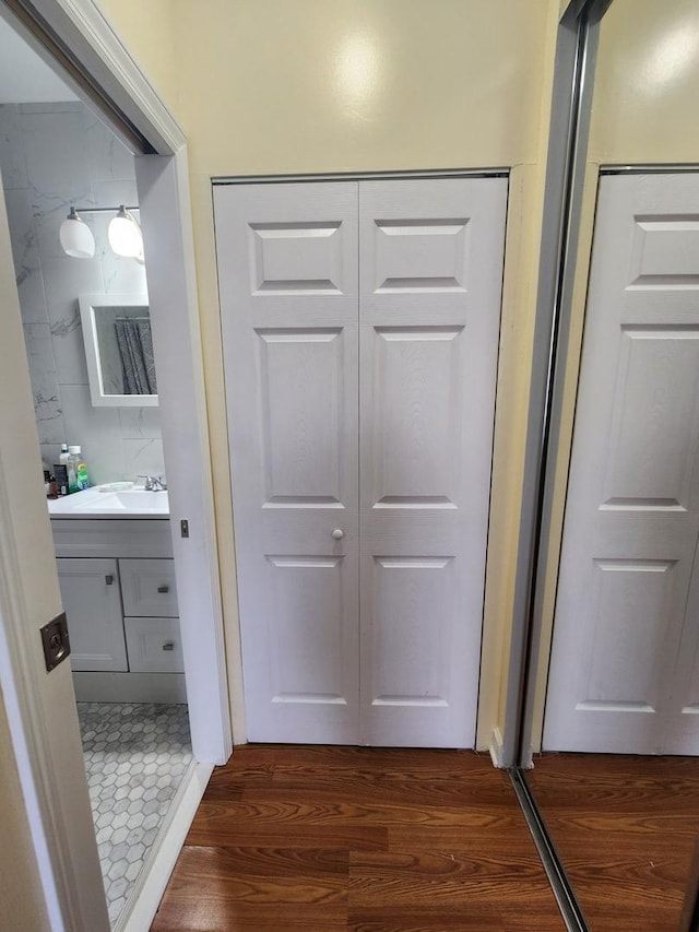 hallway with dark wood-type flooring