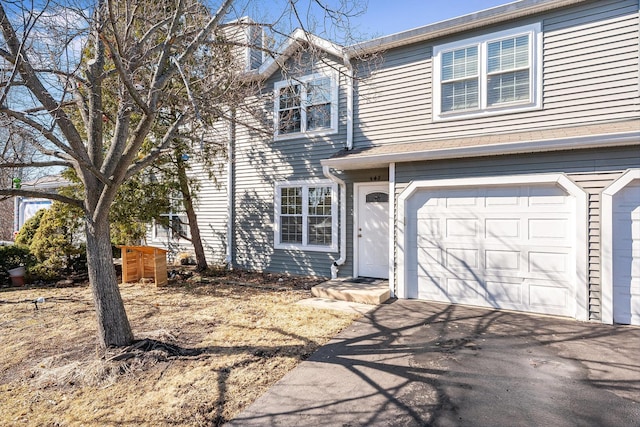 view of front of home with a garage and driveway