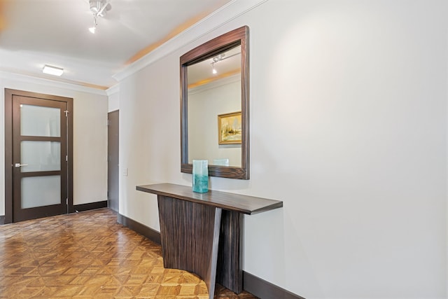 hall with baseboards and ornamental molding