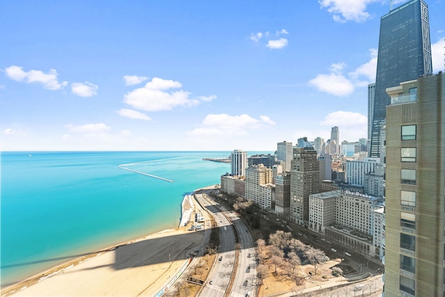 view of water feature featuring a view of city and a view of the beach