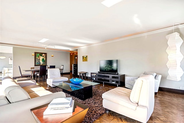 living area with ornamental molding and baseboards