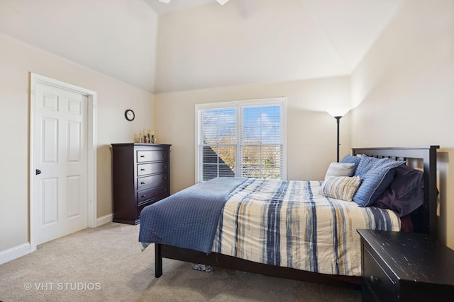 bedroom featuring light carpet and baseboards