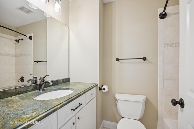 bathroom with visible vents, toilet, and vanity