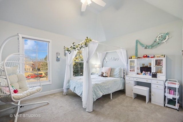 bedroom with baseboards, light carpet, high vaulted ceiling, and ceiling fan