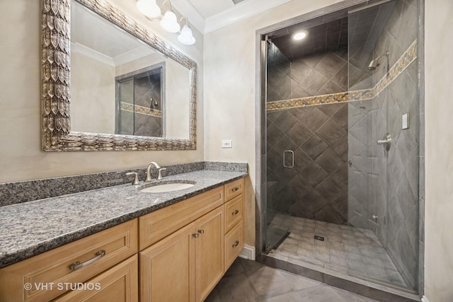 bathroom featuring tile patterned flooring, a stall shower, vanity, and ornamental molding