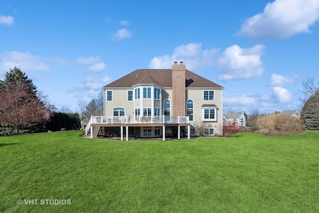 back of house featuring stairs, a lawn, a chimney, and a wooden deck