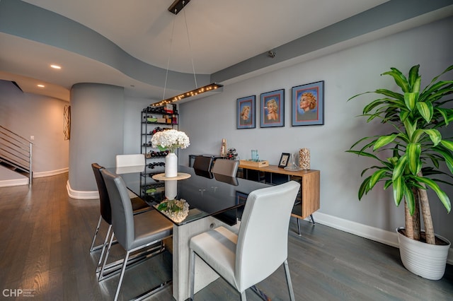 dining space with recessed lighting, wood finished floors, and baseboards