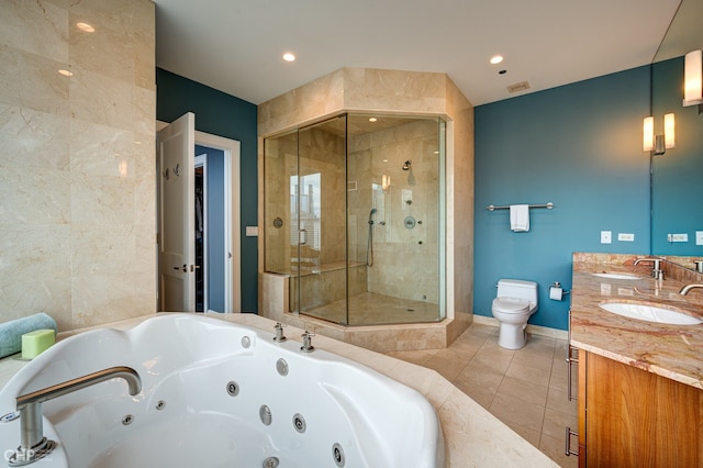 full bath featuring tile patterned flooring, a shower stall, toilet, a tub with jets, and a sink