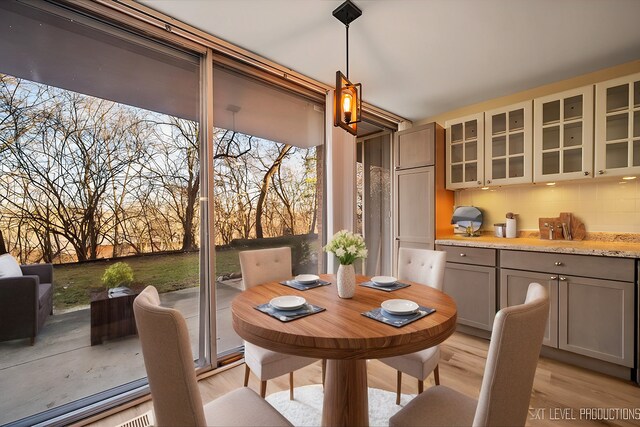 dining space featuring light wood finished floors