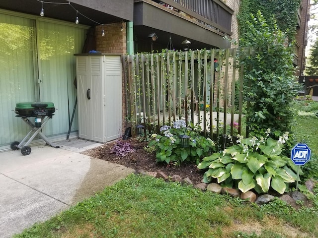 view of gate with fence