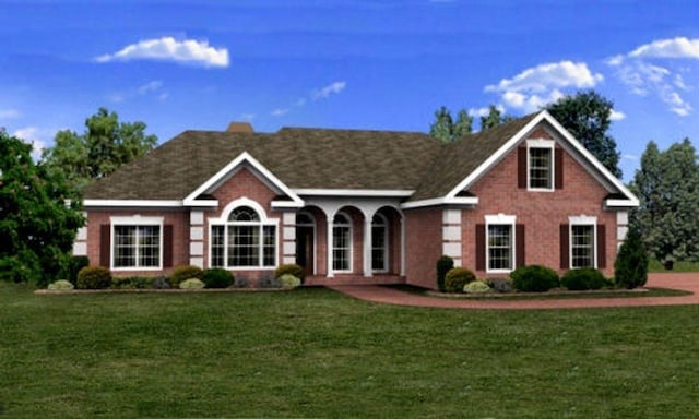 view of front of home featuring a front lawn and brick siding