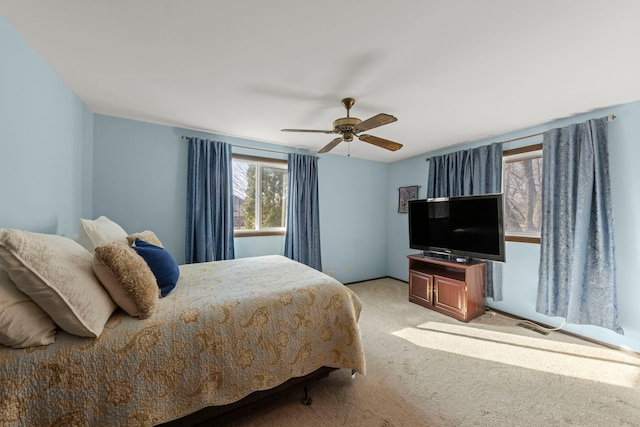 bedroom with ceiling fan and carpet floors