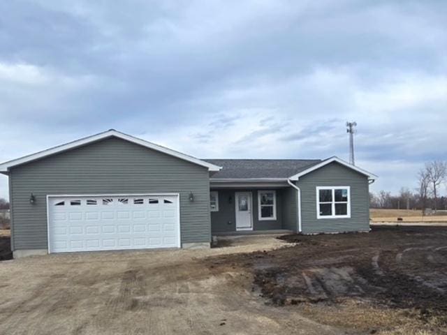 single story home with a garage and driveway