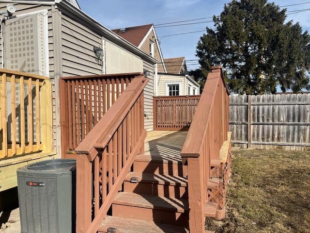 wooden deck with stairs, central AC, and fence