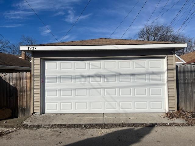 detached garage with fence