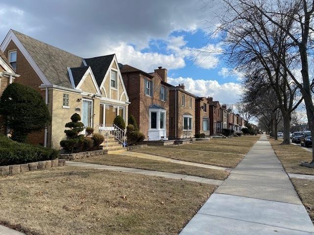 view of road featuring a residential view and sidewalks