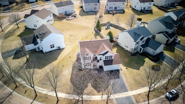 birds eye view of property with a residential view