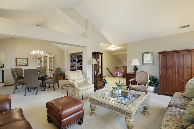 living area with high vaulted ceiling, visible vents, light carpet, and an inviting chandelier