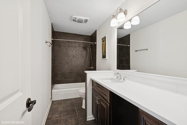 bathroom featuring visible vents, toilet, vanity,  shower combination, and tile patterned floors