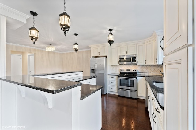 kitchen featuring appliances with stainless steel finishes, ornamental molding, backsplash, and dark wood-style floors