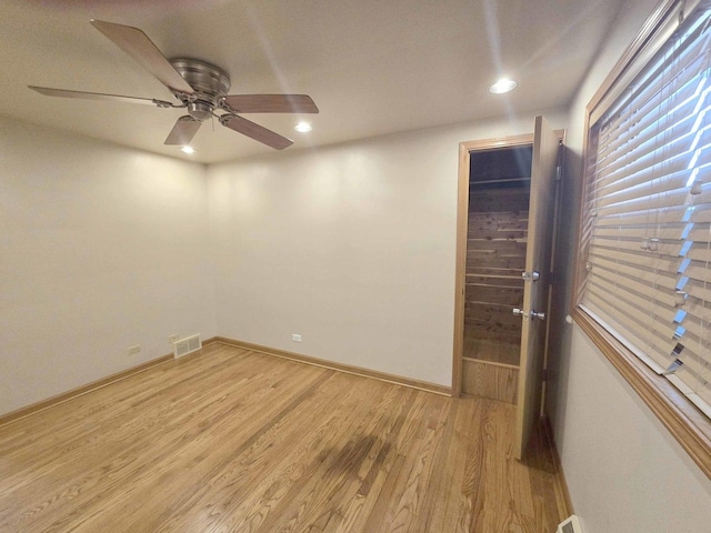 empty room featuring recessed lighting, visible vents, ceiling fan, light wood-type flooring, and baseboards