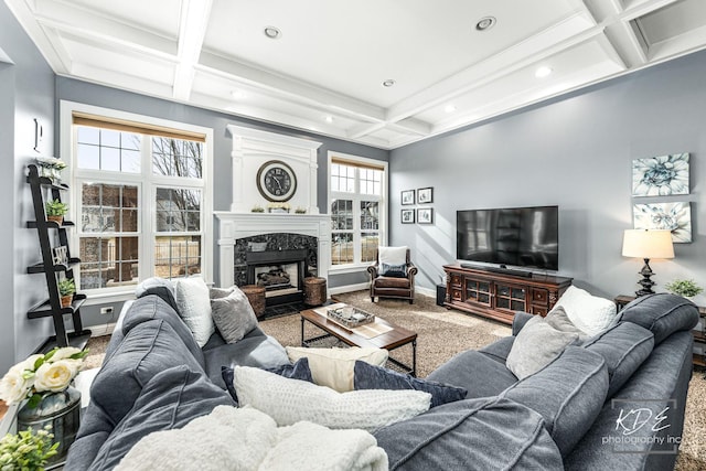 carpeted living area with beamed ceiling, coffered ceiling, a high end fireplace, and baseboards