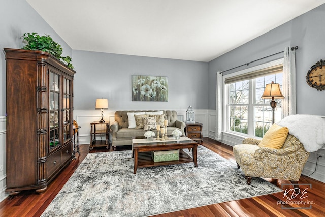 living area with dark wood-style floors and wainscoting