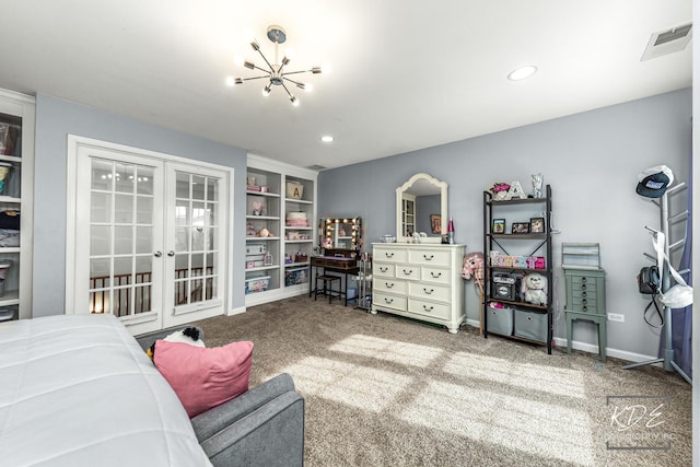 living area with visible vents, baseboards, french doors, carpet, and an inviting chandelier