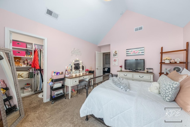 bedroom featuring light carpet, high vaulted ceiling, a spacious closet, and visible vents