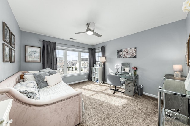 carpeted bedroom with a ceiling fan, visible vents, and baseboards